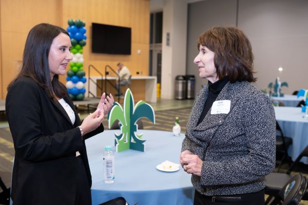 Law students and donors mingling at the Tulane Law Celebration of Scholarship