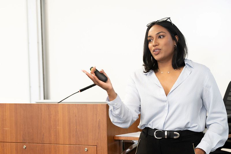A photo of Chelsey Antony speaking at a podium