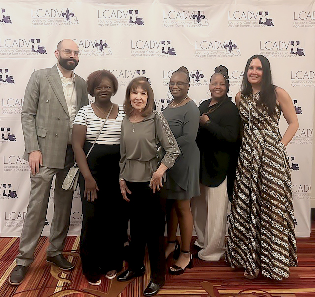 Domestic Violence Clinic Faculty posing with clients at LCADV awards