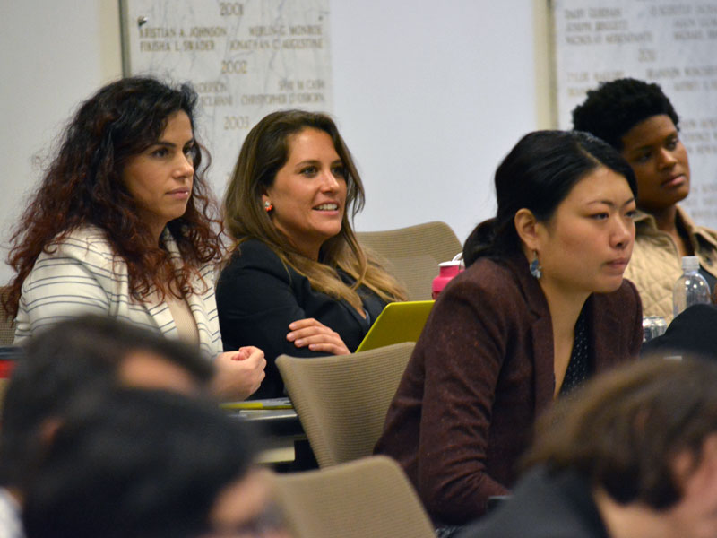 Law students listen attentively in class