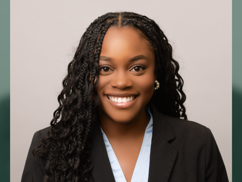 Francesqa Kaggwa smiles for a professional headshot.