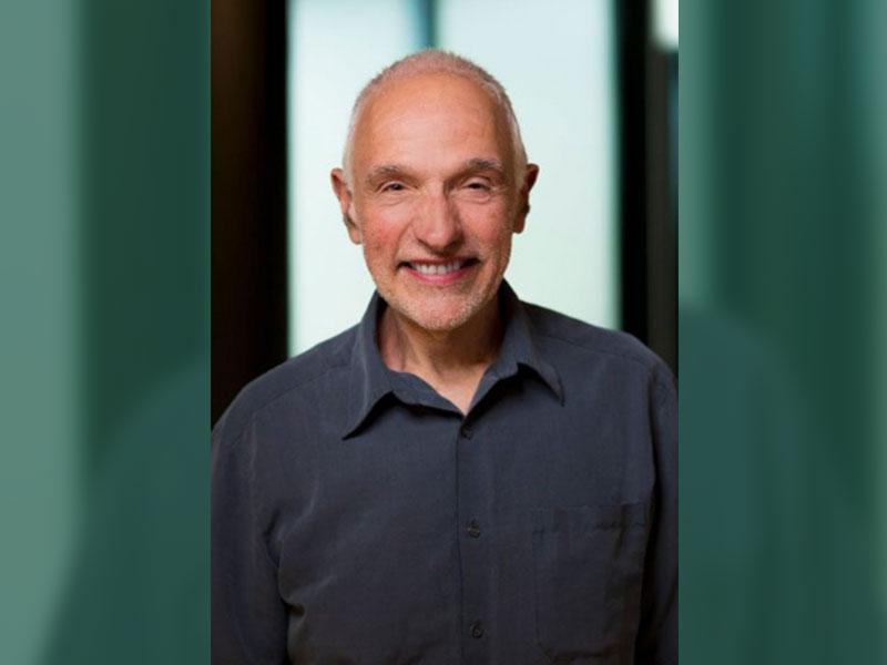 Professor Robert Merkin KC smiles for a photo.