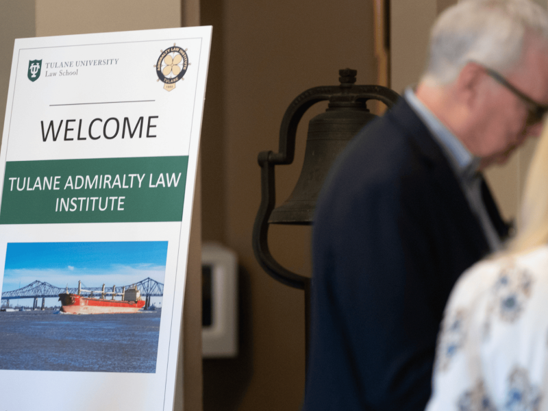 Welcome sign for Tulane Admiralty Law Institute, showing a cargo ship photo.