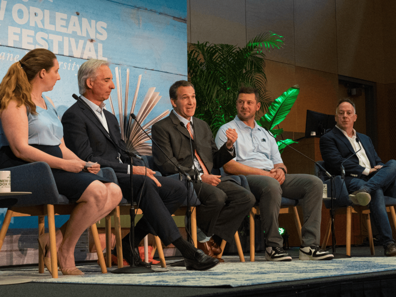 Five panelists on stage at the New Orleans Book Festival.