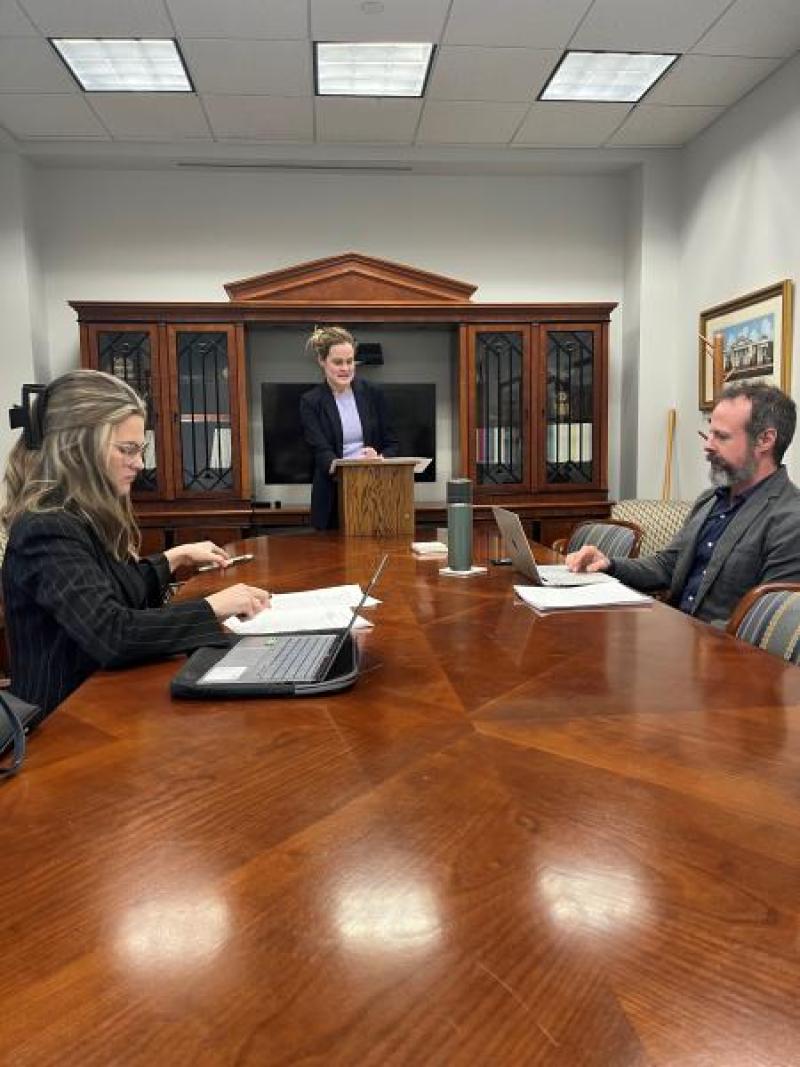 Brandao, right, mooting a case with two students who recently argued before the Fifth Circuit.