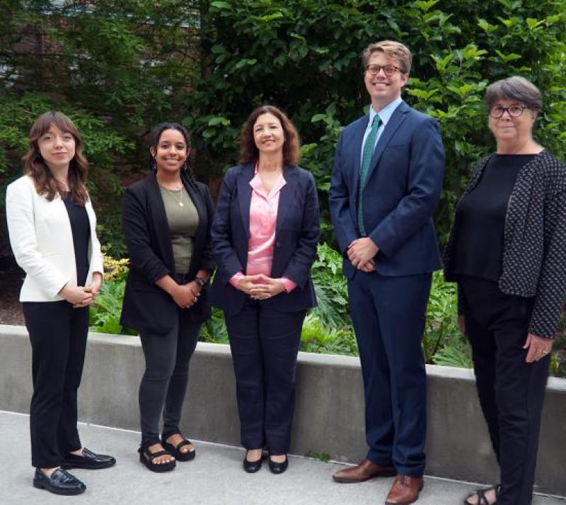 Group photo of the Tulane Environmental Law Clinic. Five members of the Tulane Environmental Law Clinic stand for a photo outside.