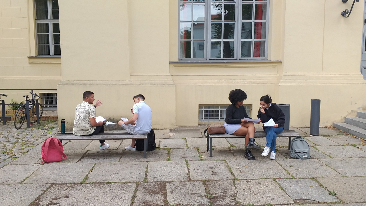 Students during Tulane Law's Berlin summer program discuss coursework at Humboldt University.