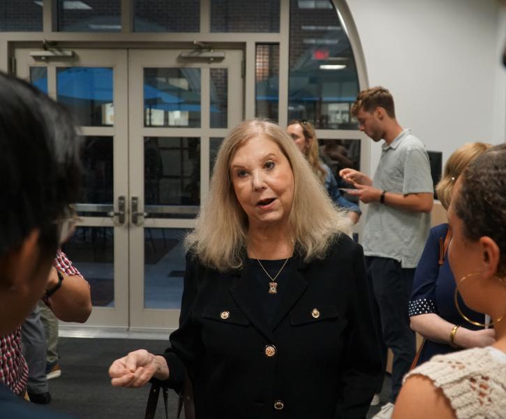 Alumna Darleen Jacobs (L'81) speaks with students after the launch event.