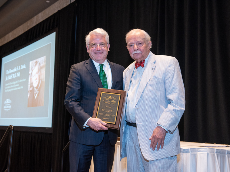 Judge F.A. "Pappy" Little, right, was inducted into the Tulane Law Hall of Fame in 2023 by then-Dean David Meyer (left). Little died at the age of 87 in late March. (Photo credit: Tracie Morris Schaefer)