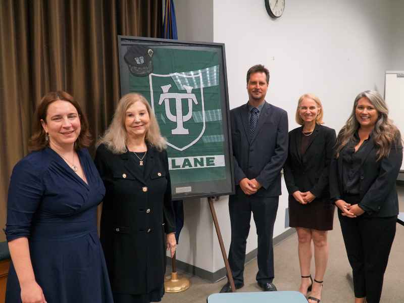 (L-R) Interim Law Dean Sally Richardson, alumna Darleen Jacobs (L'81), Professor Wian Erlank, Dr. Danielle Carroll and Professor Jeanne Amy (L'16) at the Space Law Launch event Sept. 14 -- with the Tulane flag and cap that went to space with ret. Col. Doug Hurley (E’88). The event formally launched the law school's Space Law Program. (Photo Credit: Alina Hernandez )