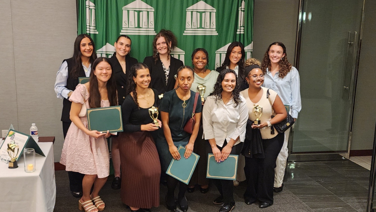 Students pose for a group photo at the SLLS Awards event,