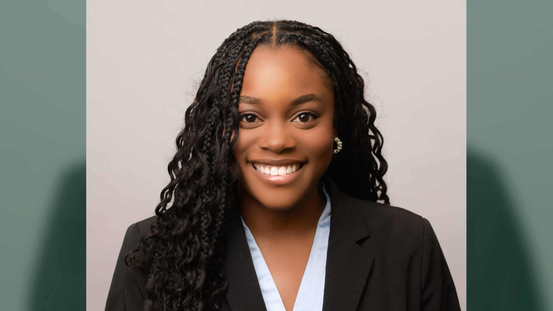 Francesqa Kaggwa smiles for a professional headshot.