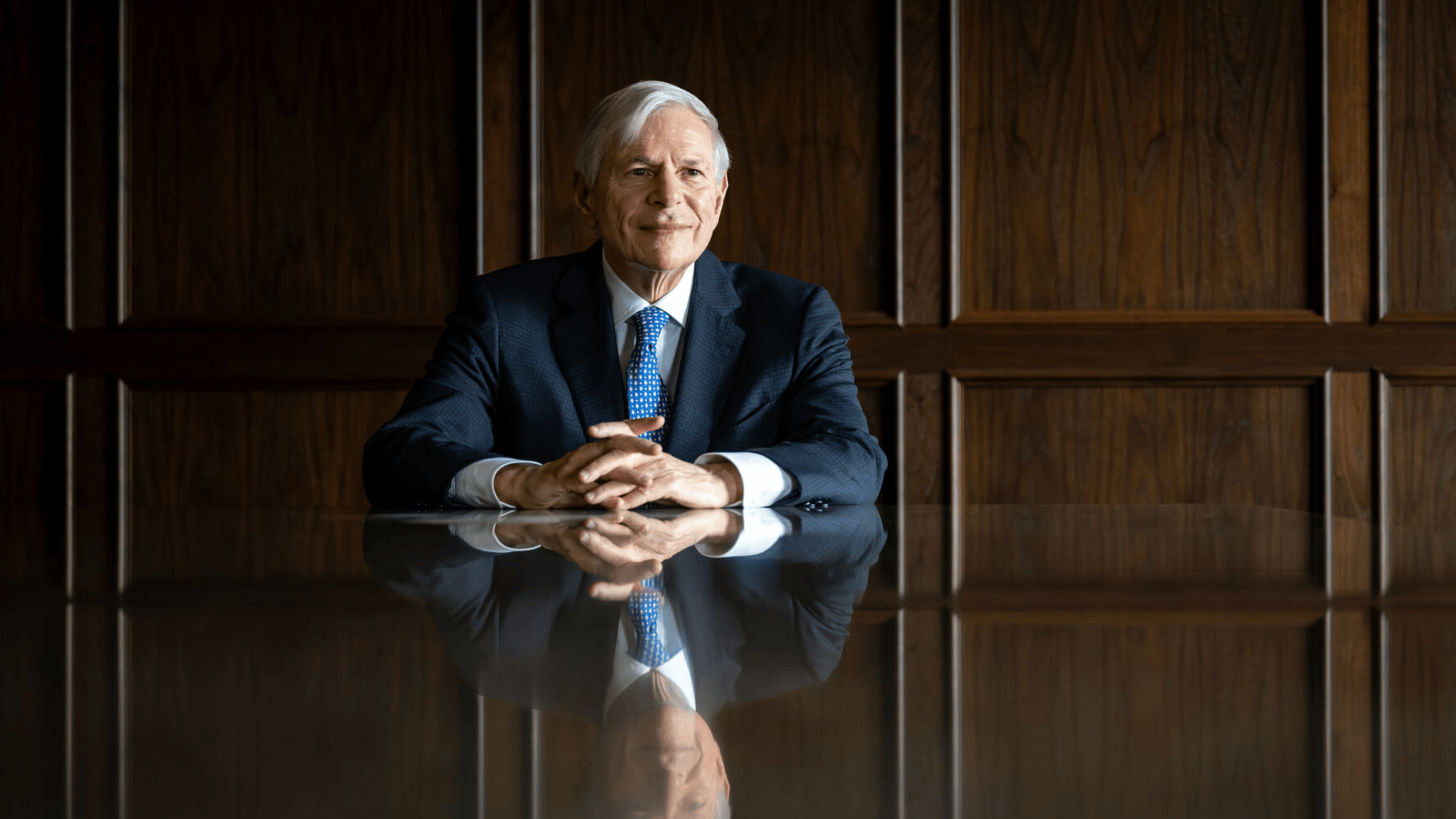 David Kerstein sits at a boardroom table.