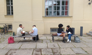 Students during Tulane Law's Berlin summer program discuss coursework at Humboldt University.