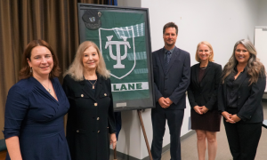 (L-R) Interim Law Dean Sally Richardson, alumna Darleen Jacobs (L'81), Professor Wian Erlank, Dr. Danielle Carroll and Professor Jeanne Amy (L'16) at the Space Law Launch event Sept. 14 -- with the Tulane flag and cap that went to space with ret. Col. Doug Hurley (E’88). The event formally launched the law school's Space Law Program. (Photo Credit: Alina Hernandez )