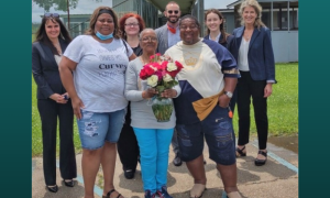 WPP team members with a client who was released in 2021 after serving 37 years, 8 months, and 17 days for an act of self-defense against sexual assault. (Photo Credit: WPP)