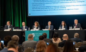 Six professionals on a panel at a Tulane University Law School conference.