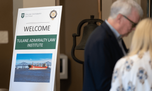 Welcome sign for Tulane Admiralty Law Institute, showing a cargo ship photo.