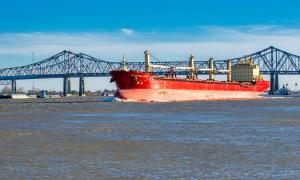 Red cargo ship on the Missisippi River In New Orleans